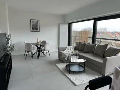 a living room with a couch and a table at Luxury Apartment near Expo 12 & ING Arena & Atomium in Wemmel