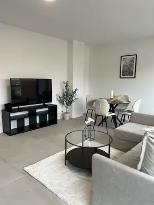 a living room with a couch and a table at Luxury Apartment near Expo 12 & ING Arena & Atomium in Wemmel
