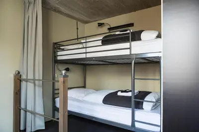 a couple of bunk beds in a room at Lux Loft in the heart of Historic Antwerp in Antwerp