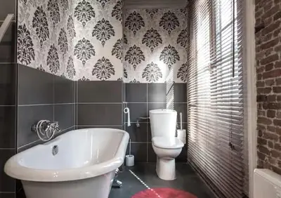 a bathroom with a toilet and a tub and a sink at Lux Loft in the heart of Historic Antwerp in Antwerp