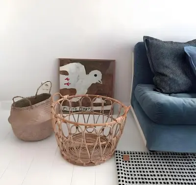 a basket sitting next to a chair and a couch at Peaceful retreat in Brussels