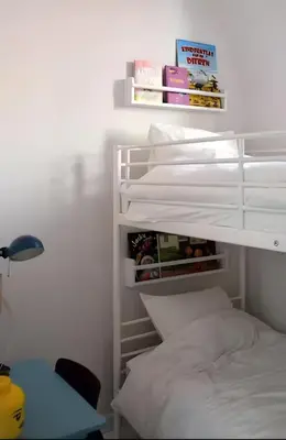 a bedroom with a bunk bed and a desk at Peaceful retreat in Brussels