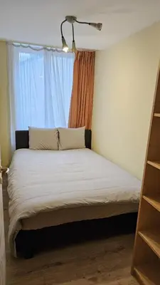 a bed in a room with a window at Bourse Grand Place in Brussels