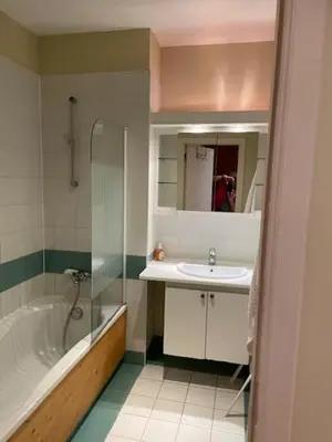 a bathroom with a tub and a sink and a shower at Bourse Grand Place in Brussels