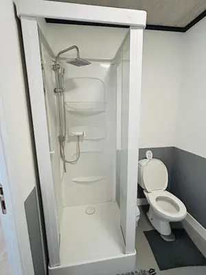 a bathroom with a shower and a toilet at The Nest In Leuven -Cosy room near Brussels in Leuven