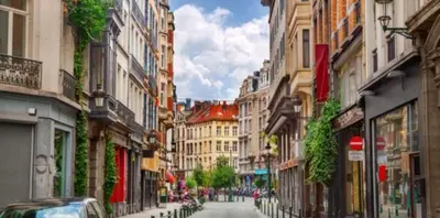 a view of a city street with buildings at Grand place in Brussels