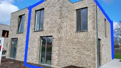 a rendering of a brick house with a blue line separating it at YOURhouse in Geel