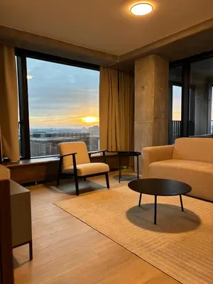 a living room with a couch and a table at Luxurious apartment in city center in Brussels