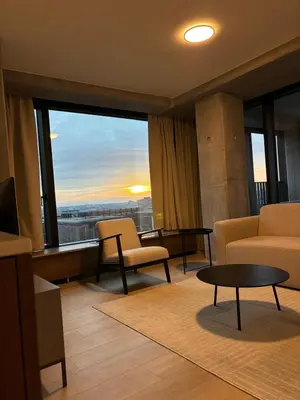 a living room with a couch and a table at Luxurious apartment in city center in Brussels