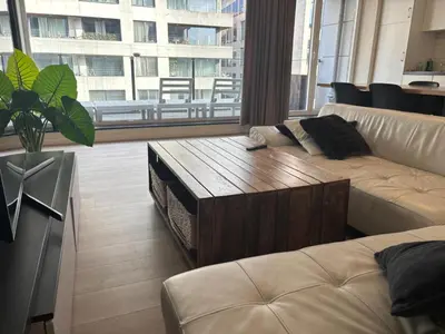 a living room with a couch and a coffee table at Appartement 3chambres en plein centre-ville in Brussels