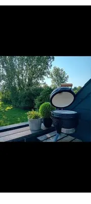 a toilet sitting on a table next to some plants at Vakantiewoning centraal in België, veel privacy, prachtig uitzicht, airco in Denderleeuw