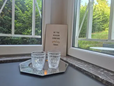 two glasses sitting on a tray next to a window at Souverain 94 in Brussels