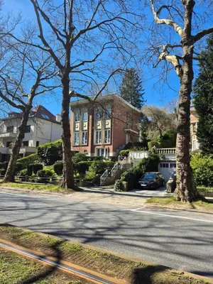 a street in front of a large brick house at Souverain 94 in Brussels