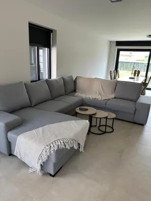 a living room with a couch and two tables at Sœur in Berlare