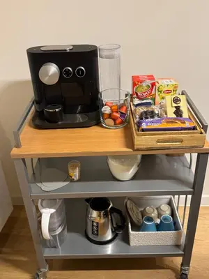 a table with a coffee maker on top of it at DePearl in Brussels