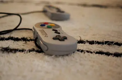 a nintendo wii game controller sitting on a rug at Stylish & Spacious Flat viewing the Lovely MAS in Antwerp