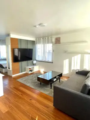 a living room with a couch and a coffee table at Green Spot Meise - 15 min from Brussels with free parking & Self check-in in Meise