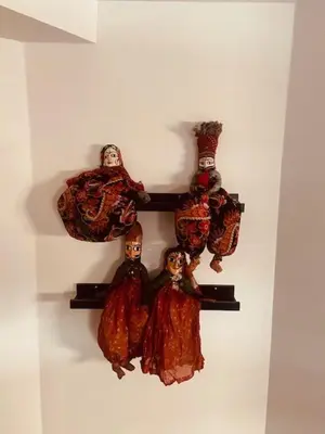 a group of figurines on a shelf on a wall at Charming & Spacious Duplex viewing the lovely MAS in Antwerp