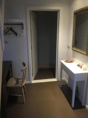a room with a desk and a chair and a mirror at Luttelkolen in Holsbeek