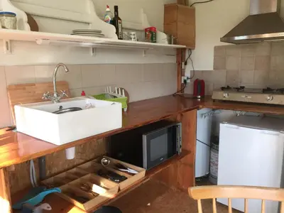 a kitchen with a sink and a microwave at Luttelkolen in Holsbeek