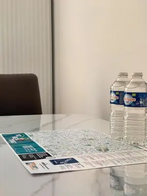 two bottles of water sitting on top of a table at Bora Apartment in Brussels