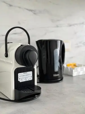 a toaster sitting on a counter next to a coffee maker at Bora Apartment in Brussels