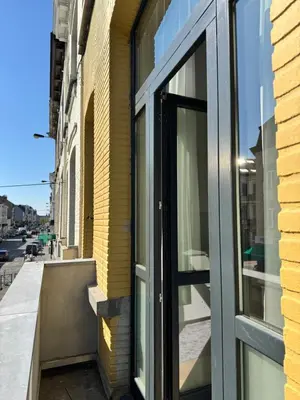 a window on the side of a building at MIDI cozy apartment in Brussels