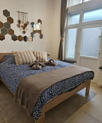 a bedroom with a bed with two teddy bears on it at Proche du centre de Bruxelles, Atomium,Tour&Taxi,ING Arena in Brussels