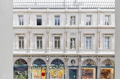 a large white building with statues in front of it at Apartment in the hyper-center in Brussels