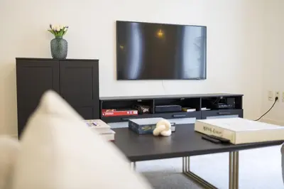 a living room with a tv and a coffee table at Apartment in the hyper-center in Brussels