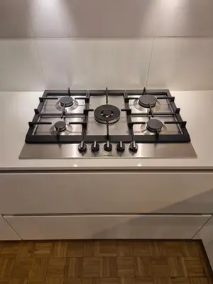 a stove top with four burners on top of it at Huis ALNA 8 in Mechelen