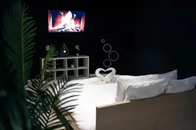 a bedroom with a bed with a heart on it at Blvck Spa in Brussels