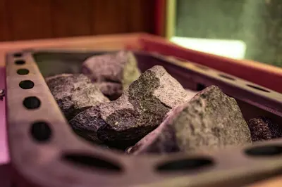 a container full of rocks sitting on a table at Blvck Spa in Brussels
