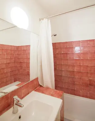 a bathroom with a white sink and a shower at Brand new & cosy - Louise & Stéphanie area in Brussels