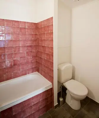 a bathroom with a toilet and a bath tub and a toilet at Brand new & cosy - Louise & Stéphanie area in Brussels
