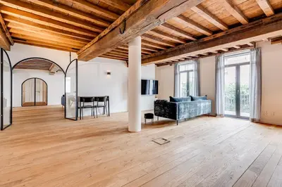 a living room with a couch and a table at Beautiful spacious Loft in the Heart of Antwerp in Antwerp