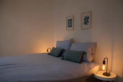 a bedroom with a bed with two pillows on it at Charming Apartment with Cathedral View in Antwerp on the 2th floor in Antwerp
