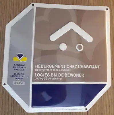 a plastic box with a sign that readslear improvement chelizard at Romantics rooms in Brussels sky in Brussels