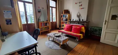 a living room with a couch and a table at Historic Brussels in Brussels