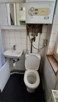 a small bathroom with a toilet and a sink at Historic Brussels in Brussels