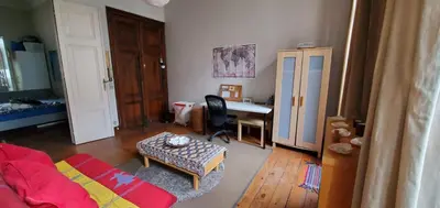 a living room with a couch and a desk at Historic Brussels in Brussels
