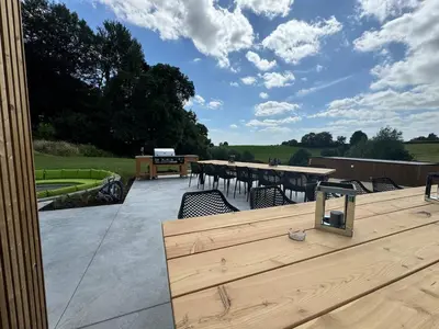 a patio with a table and chairs and a table and chairsktop at Vakantiewoning The View in Gooik