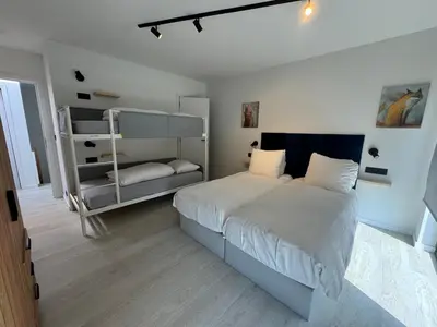a bedroom with a bed and a bunk bed at Vakantiewoning The View in Gooik