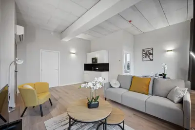 a living room with a couch and a table at Imperiashortstay in Zaventem