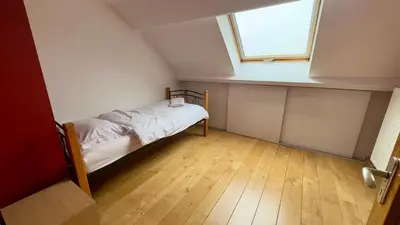 a small bedroom with a bed and a window at House with 5 bedrooms near Brussels in Wemmel