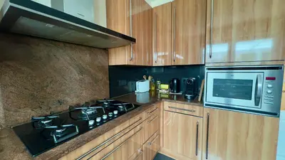a kitchen with a stove and a microwave at House with 5 bedrooms near Brussels in Wemmel