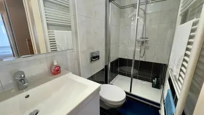 a bathroom with a shower and a toilet and a sink at House with 5 bedrooms near Brussels in Wemmel