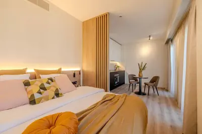 a bedroom with a large bed and a table at Stay at Brussels in Brussels