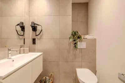 a bathroom with a toilet and a sink at Stay at Brussels in Brussels
