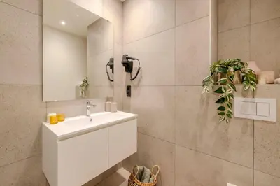 a bathroom with a sink and a mirror at Stay at Brussels in Brussels
